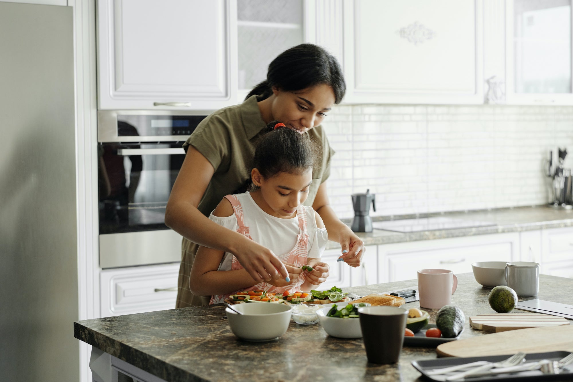 mother teaching child about nutritious plant-based food